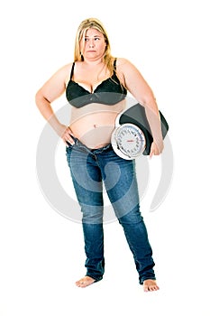 Obese woman holding weighing scales under arm