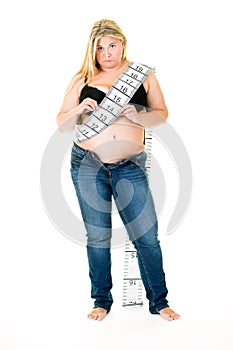 Obese woman with long tape measure around body