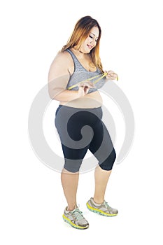 Obese woman measures her chest