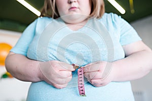 Obese Woman Measuring Waist