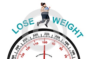 Obese woman running above a weighing scale