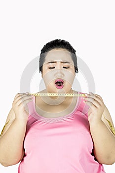 Obese woman shocked with measuring tape