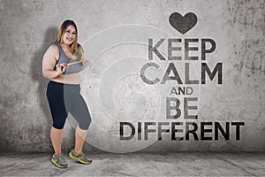 Obese woman with text of keep calm and be different