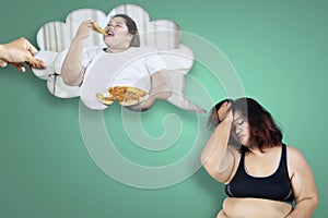 Obese woman thinking her unhealthy habit