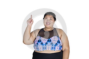 Obese woman thinking an idea on studio