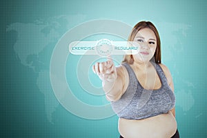 Obese woman touching virtual screen