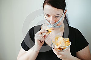 Obese woman with unhealthy food, eating disorder