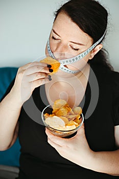 Obese woman with unhealthy food, eating disorder