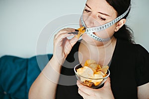 Obese woman with unhealthy food, eating disorder