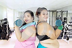 Obese women doing exercise together