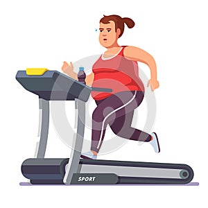 Obese young woman running on treadmill