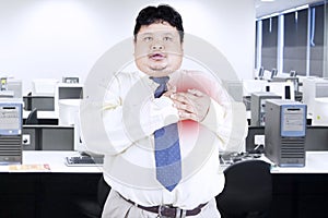 Obesity businessman getting heart attack