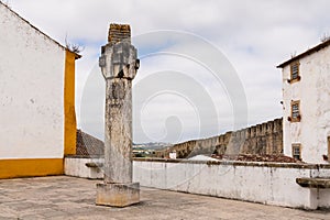 Obidos, Portugal - June 30, 2021: The Pilar Camoneano, erected in 1932 in honor of poet Luis de Camoes