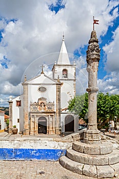 Obidos, Portugal. Medieval Town Pillory and Santa Maria Church