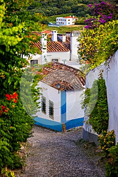 Obidos, Portugal stonewalled city with medieval fortress, historic walled town of Obidos, near Lisbon, Portugal. Beautiful view of