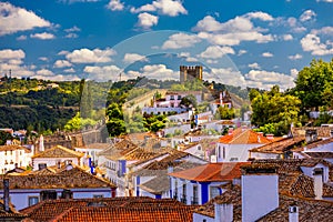 Obidos, Portugal stonewalled city with medieval fortress, historic walled town of Obidos, near Lisbon, Portugal. Beautiful view of
