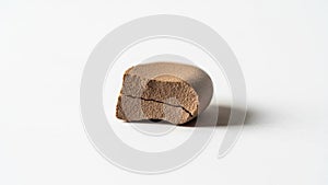 The object casts a soft shadow emphasizing its three dimensional