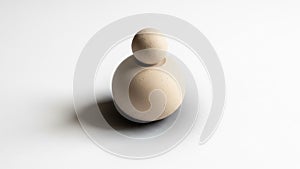 The object casts a subtle shadow on the white surface, emphasizing its