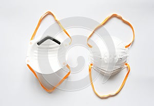 Object, white half-face dust mask with  yellow elastic or rubber straps on white background. Product use for protect against dusts