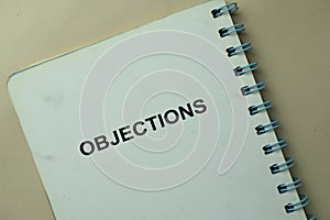 Objections write on a book isolated on office desk photo