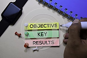 Objective Key Results - OKR text on sticky notes  on office desk