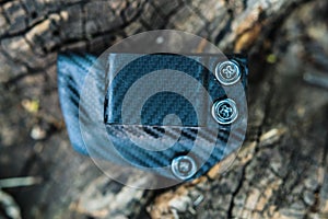 Objective shooting holster on the bark of a tree in the forest