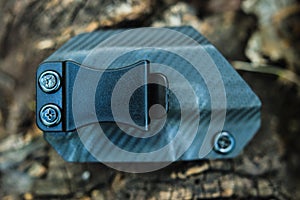 Objective shooting holster on the bark of a tree in the forest