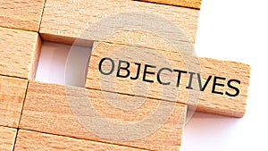 Objectives written on wood blocks. Business concept.A piece of wood with text OBJECTIVES