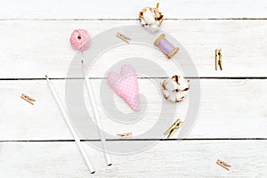 Objects for creativity on a white wooden background. Sewing flat