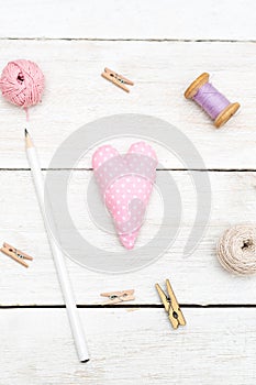 Objects for creativity on a white wooden background. Vertical ph