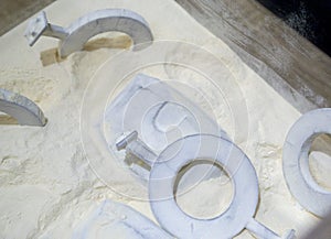 Objects printed 3D printer from powdered polyamide lying white polyamide powder