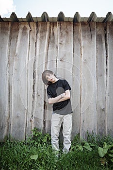 Oblique standing teenage boy