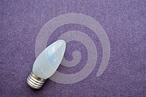 Oblong, ordinary, uneconomical incandescent bulb with gray glass photo