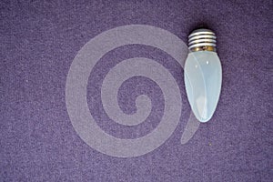 Oblong, ordinary, uneconomical incandescent bulb with gray glass photo