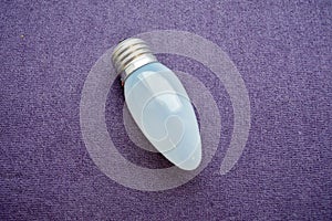 Oblong, ordinary, uneconomical incandescent bulb with gray glass photo