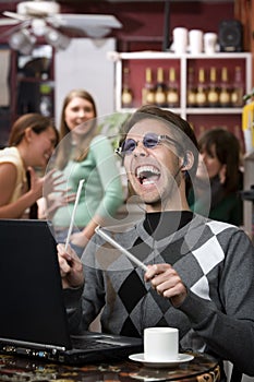 Obnoxious young man singing loudly