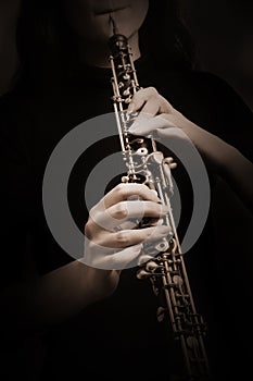 Oboe player. Hands with Music instrument closeup