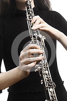 Oboe player hands playing musical instrument