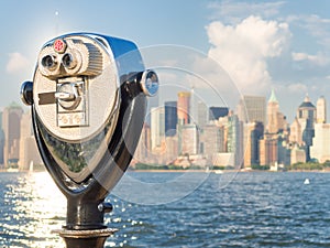 Observation deck with binoculars looking at the New York skyline