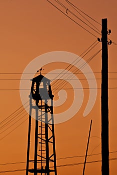 Observation fire tower on a backgraund of sunset