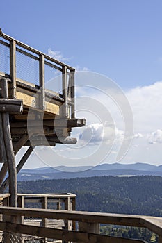 Observation tower located at the top of the SÅ‚otwiny Arena ski station, leading in the treetops, beautiful panorama of the