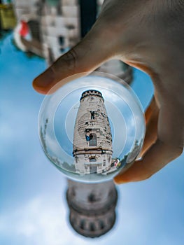 Observation Tower on peak of Wielka Sowa mountain reflected in crystal glassy lensball