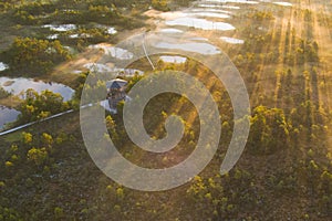 Observation tower in the Viru swamp at sunrise, photo from a drone