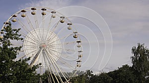 observation wheel against the sky. big wheel against blue sky. Ferris Wheel Against a Blue Sky