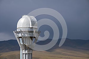 Observatory telescope on green valley among mountains mountains in day, great design for any purposes.