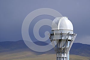 Observatory telescope on green valley among mountains mountains in day, great design for any purposes.