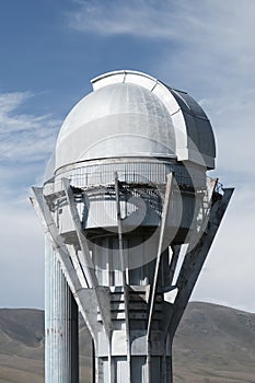 Observatory telescope on green valley among mountains mountains in day, great design for any purposes.