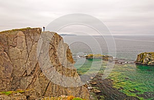 Observer on a Rocky Ocean Coast