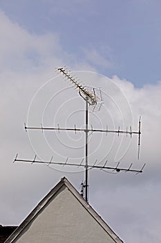 Obsolete antenna on a house roof
