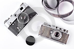 Obsolete cameras on white background.